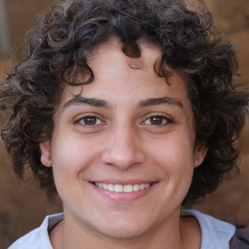 John Peterson with short hair and a neutral expression, photographed in an outdoor setting.