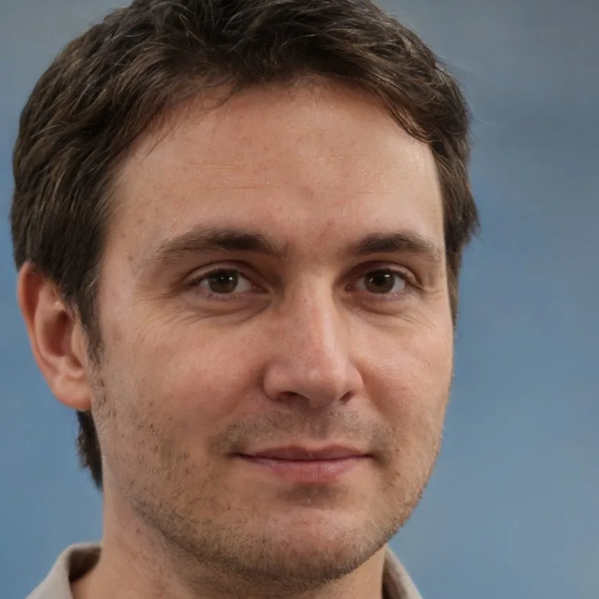 Portrait of Mark Stevens, a man with dark brown hair and a thoughtful expression.